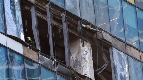 An emergencies services employee works inside a damaged skyscraper in Moscow. Photo: 1 August 2023