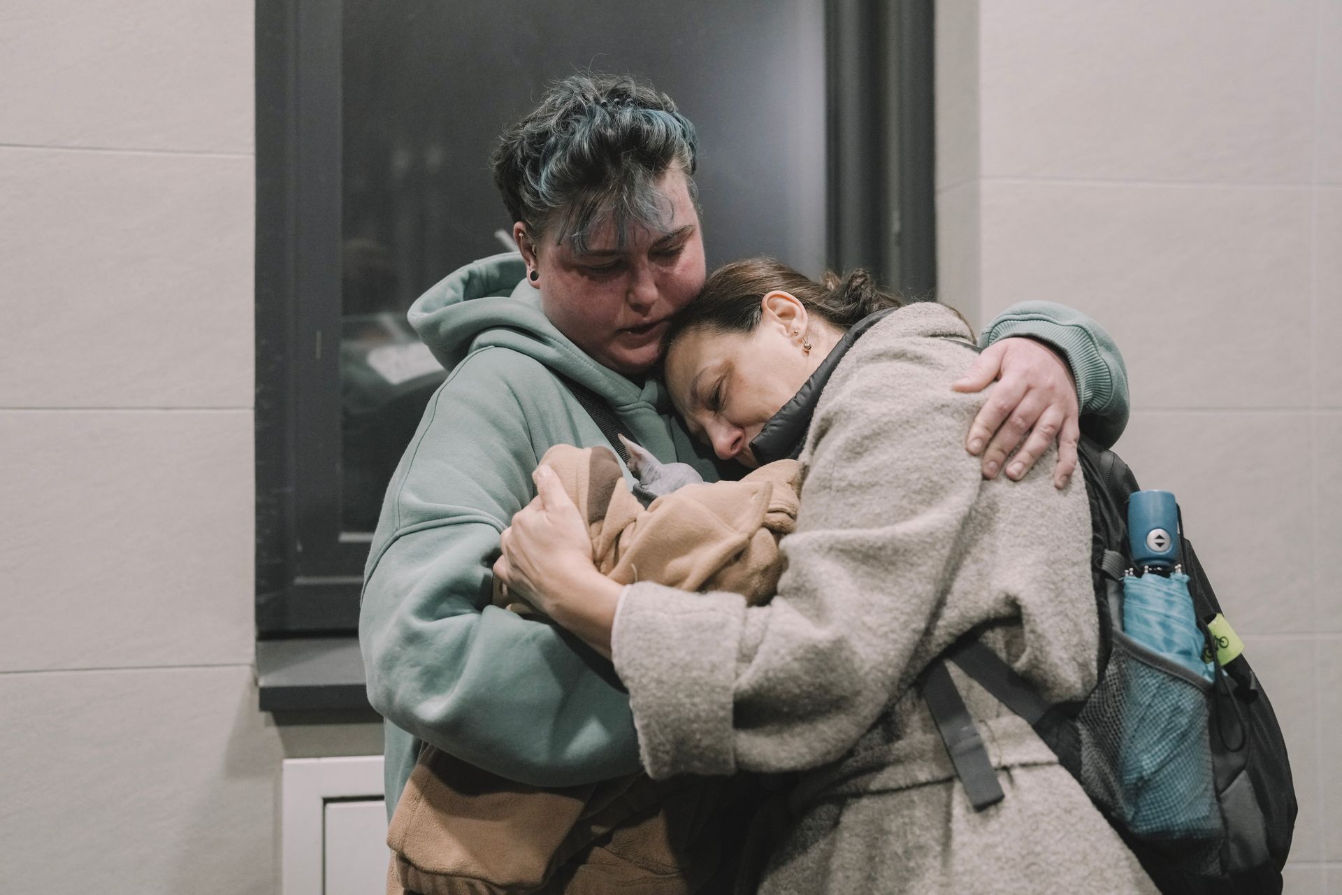 Women hug each other after a Russian missile strike in Kyiv, Ukraine, on Oct. 12, 2026. 