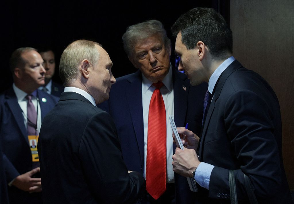 U.S. President Donald Trump (C) and Russian President Vladimir Putin (L) speak after delivering a joint press conference following a US-Russia summit on Ukraine at Joint Base Elmendorf-Richardson in Anchorage, Alaska, on Aug. 15, 2025. (Gavriil Grigorov / POOL / AFP via Getty Images)